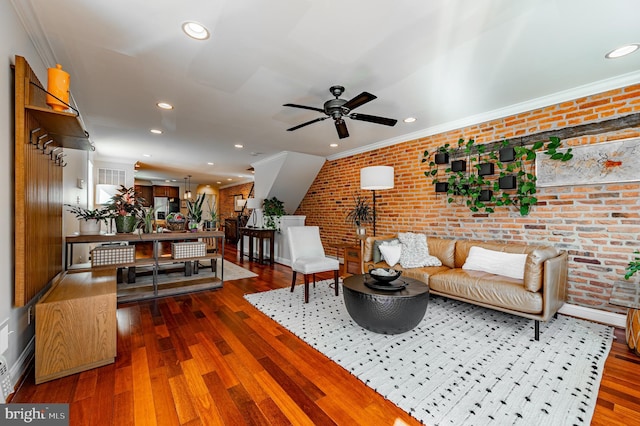 living room with recessed lighting, brick wall, a ceiling fan, dark wood-style floors, and crown molding