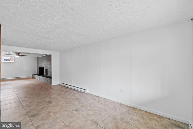 unfurnished living room featuring a fireplace, light tile patterned floors, baseboard heating, a ceiling fan, and a textured ceiling