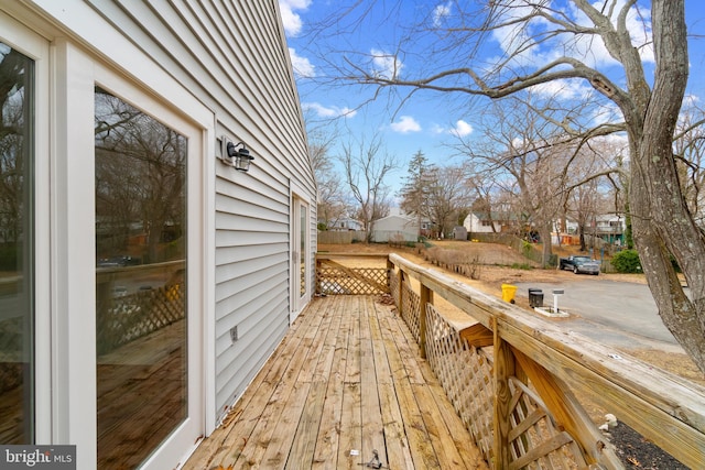 wooden terrace with a residential view