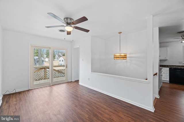 interior space with dark wood-style floors, baseboards, and visible vents