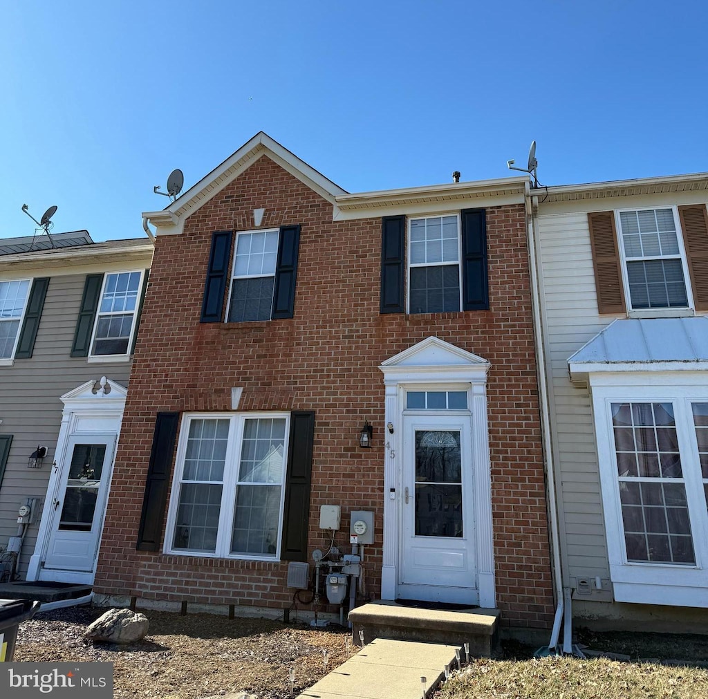 multi unit property featuring brick siding