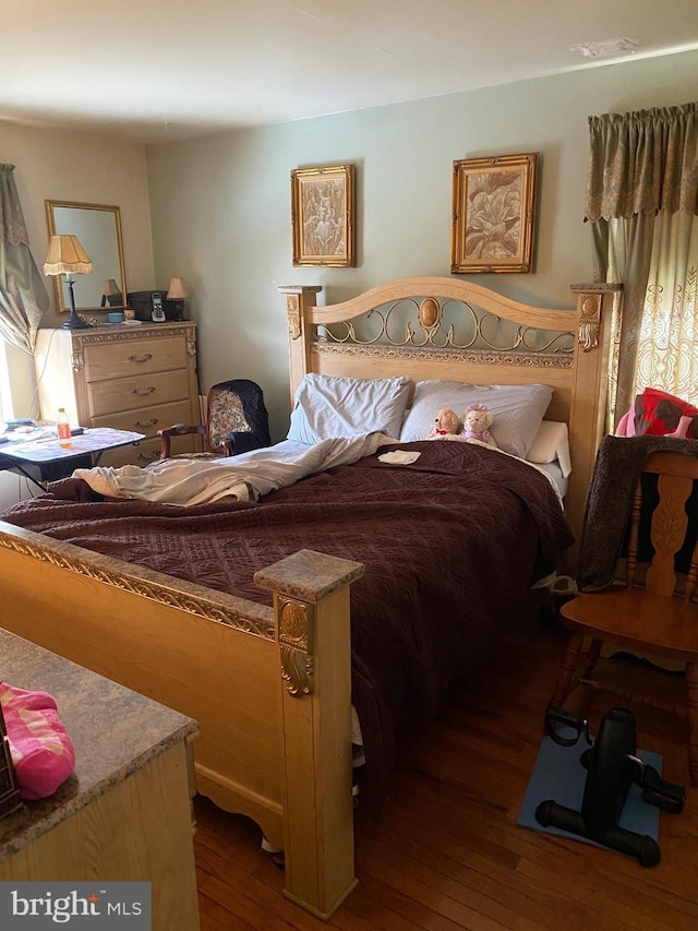 bedroom featuring dark wood-type flooring