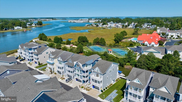 birds eye view of property with a water view and a residential view