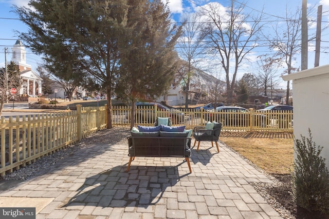 view of patio featuring an outdoor hangout area and a fenced backyard