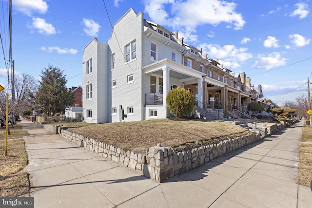 view of property exterior with brick siding