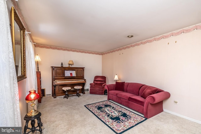 living room featuring carpet floors and baseboards