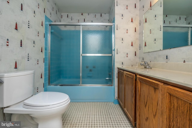 bathroom featuring tile patterned flooring, shower / bath combination with glass door, toilet, and wallpapered walls