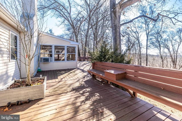 wooden terrace featuring a sunroom