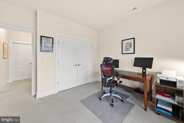 office with carpet, visible vents, and baseboards