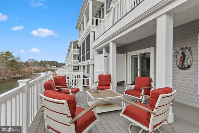 wooden deck with a water view