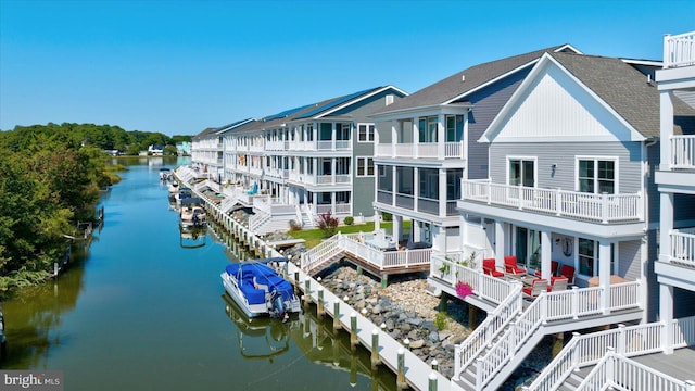 rear view of property featuring a water view