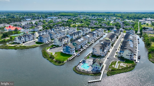 birds eye view of property with a residential view and a water view