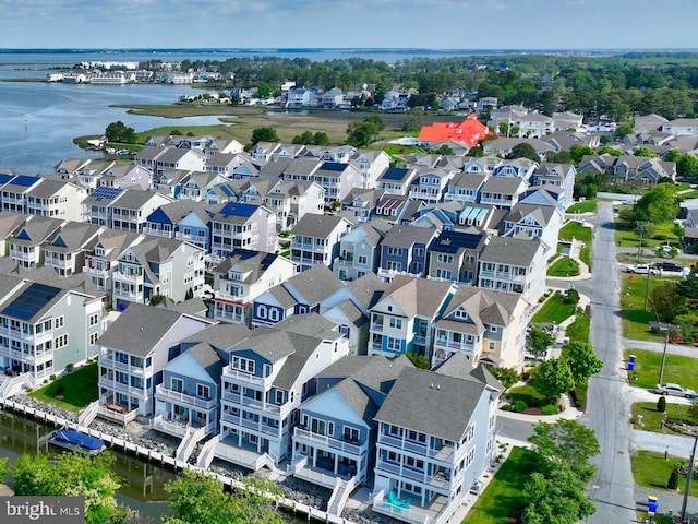 birds eye view of property with a residential view and a water view