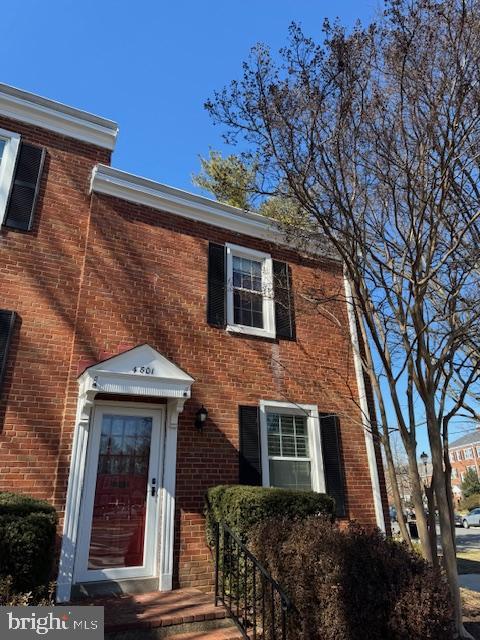 view of front of house featuring brick siding