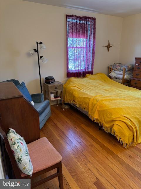 bedroom featuring wood finished floors