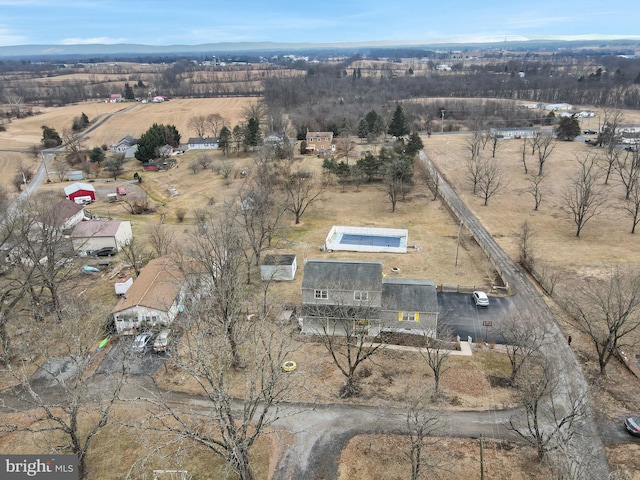 birds eye view of property featuring a rural view