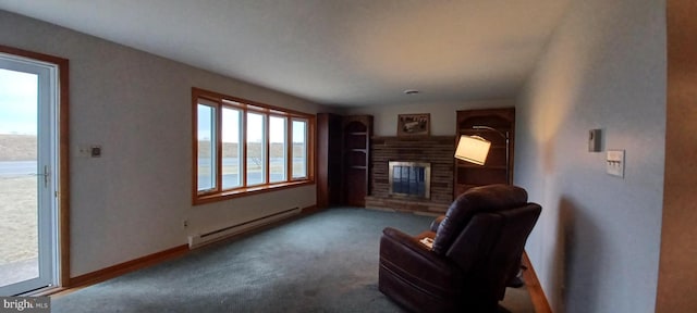 sitting room with carpet, a baseboard radiator, baseboards, and a brick fireplace