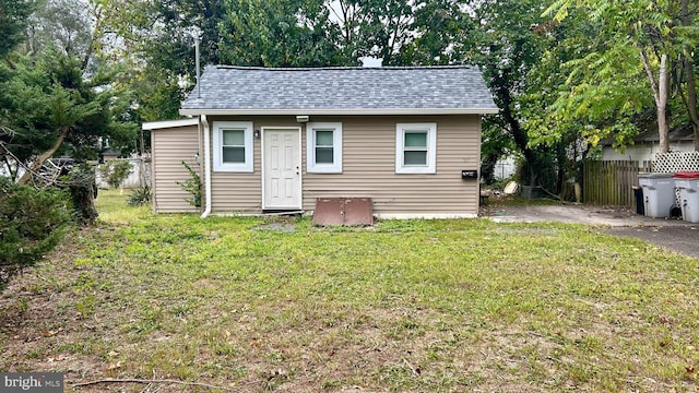 view of outbuilding with fence