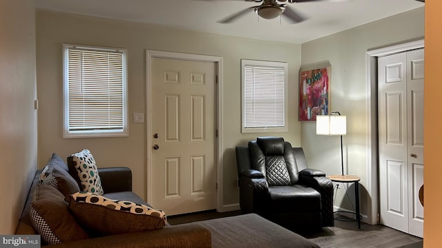 sitting room featuring wood finished floors and a ceiling fan