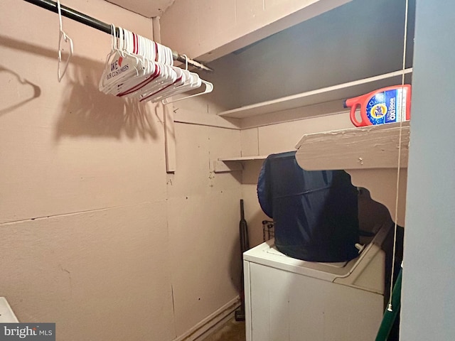 laundry area with laundry area and washer / dryer