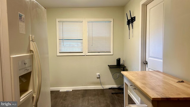 home office with baseboards and dark wood finished floors