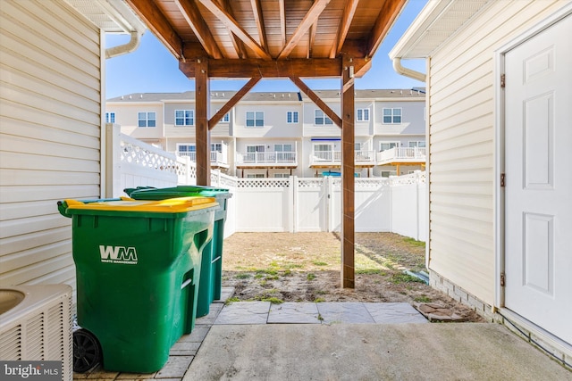 view of patio with a fenced backyard and a residential view