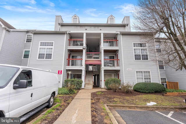 view of property featuring uncovered parking