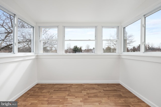 unfurnished sunroom featuring a wealth of natural light