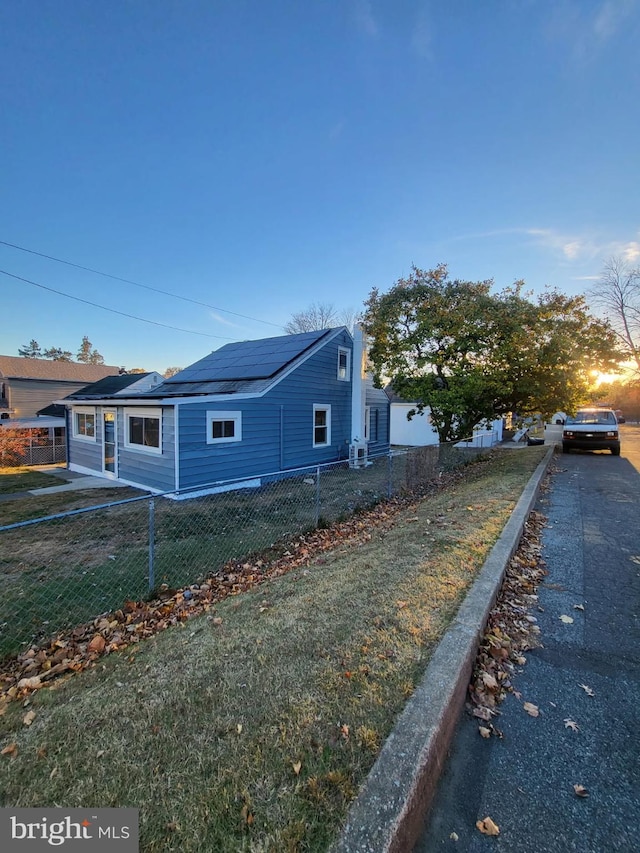 view of home's exterior with a fenced front yard