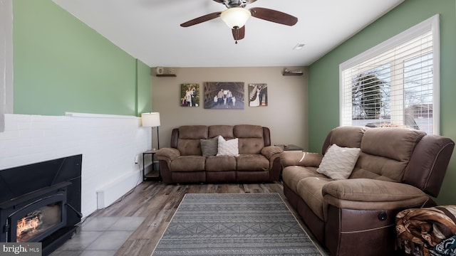 living room with ceiling fan and wood finished floors