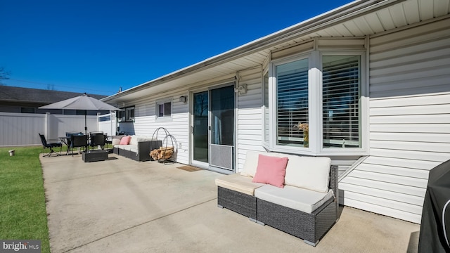 view of patio / terrace with outdoor lounge area and fence