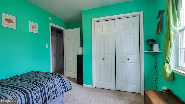 carpeted bedroom with a closet