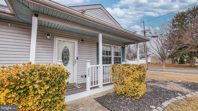 doorway to property featuring a porch