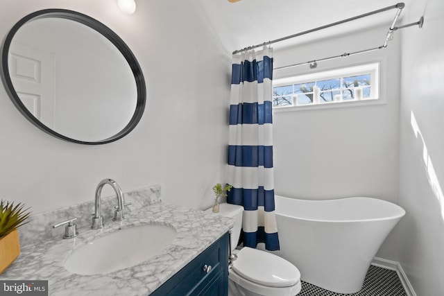 bathroom featuring vanity and toilet