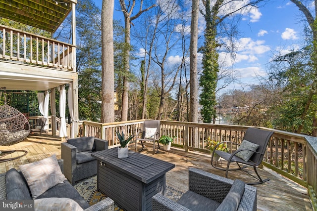 wooden terrace featuring outdoor lounge area