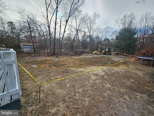 view of yard featuring a trampoline