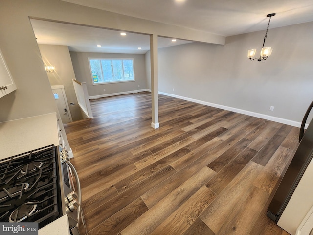 living area with recessed lighting, baseboards, dark wood finished floors, and a chandelier