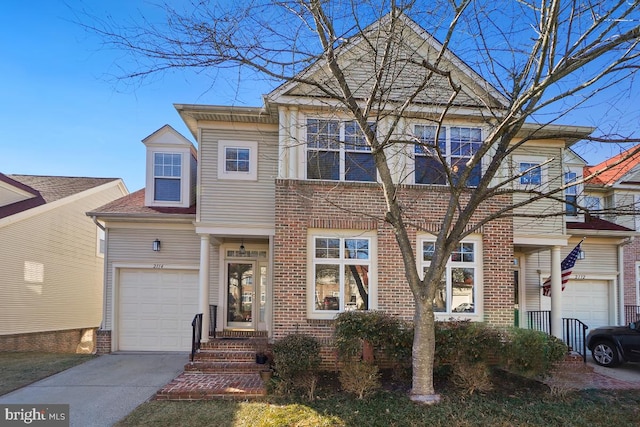 view of front facade with a garage and brick siding