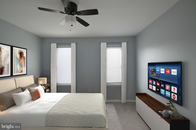 bedroom with baseboards, a ceiling fan, and light colored carpet