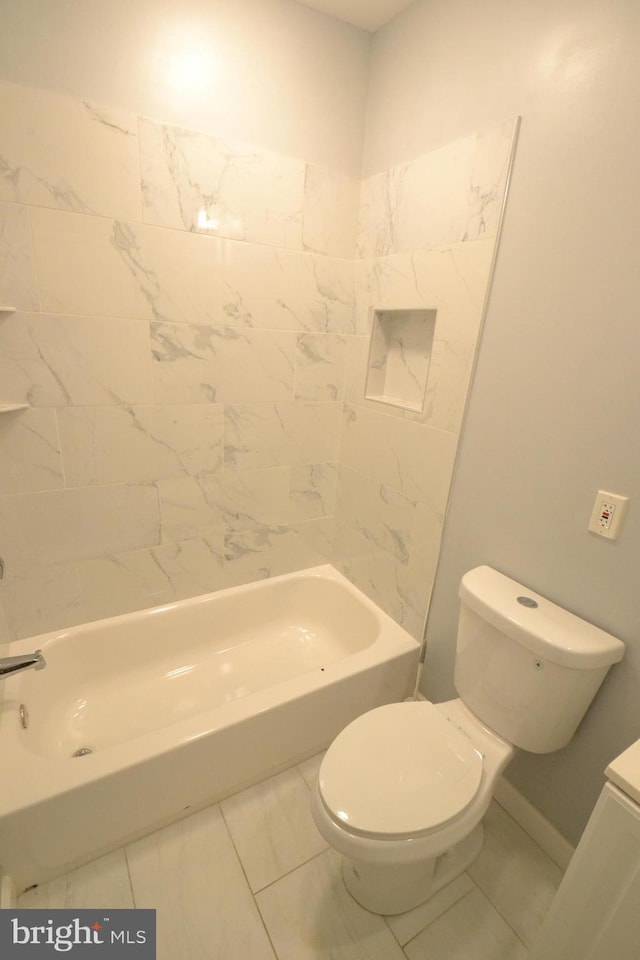 full bathroom with marble finish floor, shower / tub combination, and toilet