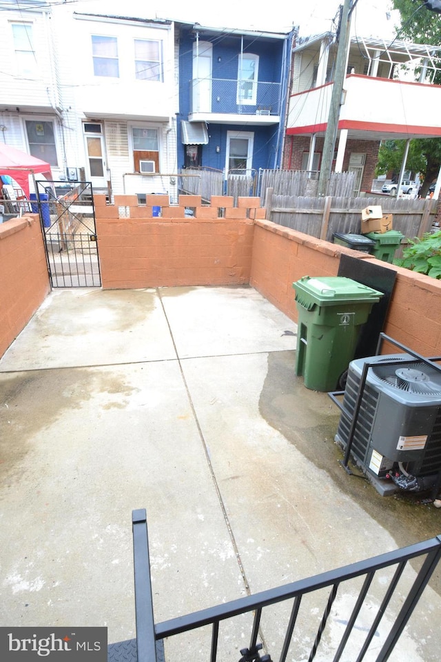 view of patio / terrace featuring fence and cooling unit