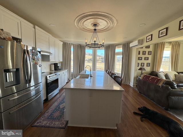 374 Finley Rd, Raphine, VA 24472 - kitchen featuring white cabinets, stainless steel appliances, a sink, open floor plan, and a notable chandelier