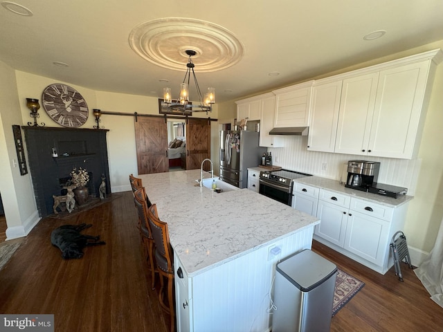 374 Finley Rd, Raphine, VA 24472 - kitchen with white cabinets, a sink, a barn door, stainless steel fridge with ice dispenser, and range with electric stovetop