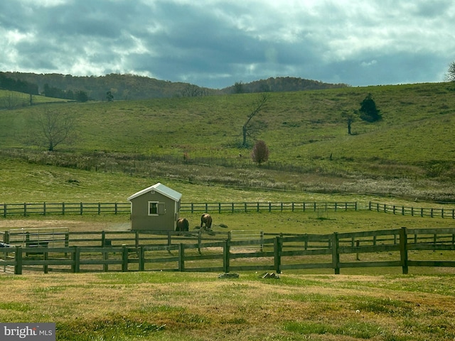 view of mountain feature with a rural view