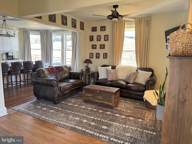 374 Finley Rd, Raphine, VA 24472 - living area with wood finished floors and ceiling fan with notable chandelier