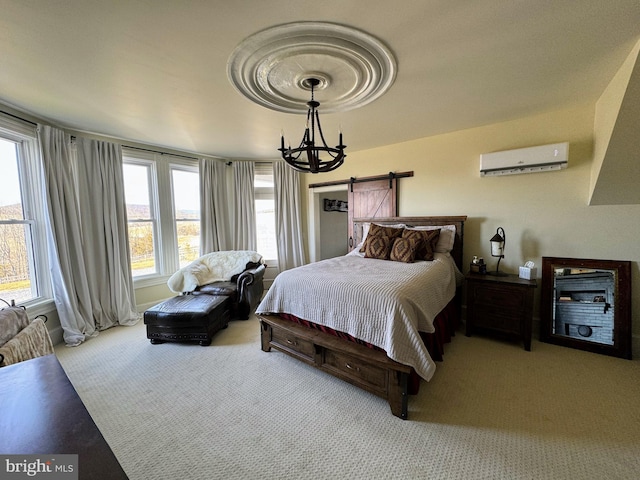 374 Finley Rd, Raphine, VA 24472 - carpeted bedroom with a barn door, a wall mounted AC, a notable chandelier, and multiple windows