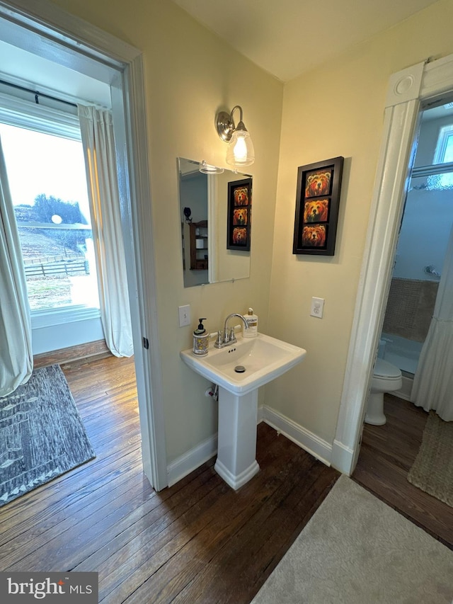 374 Finley Rd, Raphine, VA 24472 - full bath with walk in shower, wood finished floors, toilet, and baseboards