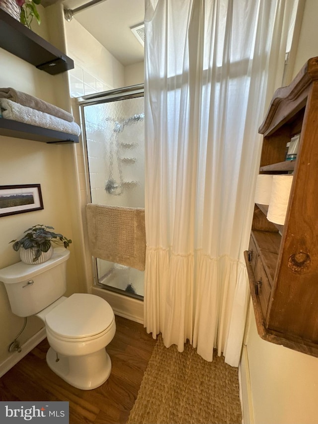 374 Finley Rd, Raphine, VA 24472 - full bathroom with a shower with curtain, wood finished floors, and toilet