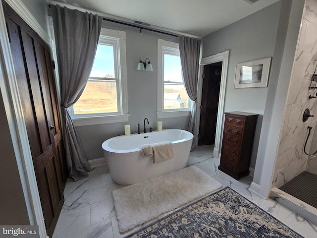 374 Finley Rd, Raphine, VA 24472 - bathroom with baseboards, marble finish floor, a freestanding bath, and a tile shower