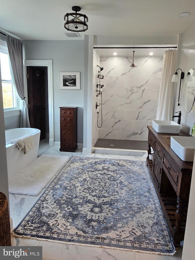 374 Finley Rd, Raphine, VA 24472 - bathroom featuring vanity, marble finish floor, a freestanding tub, and a stall shower